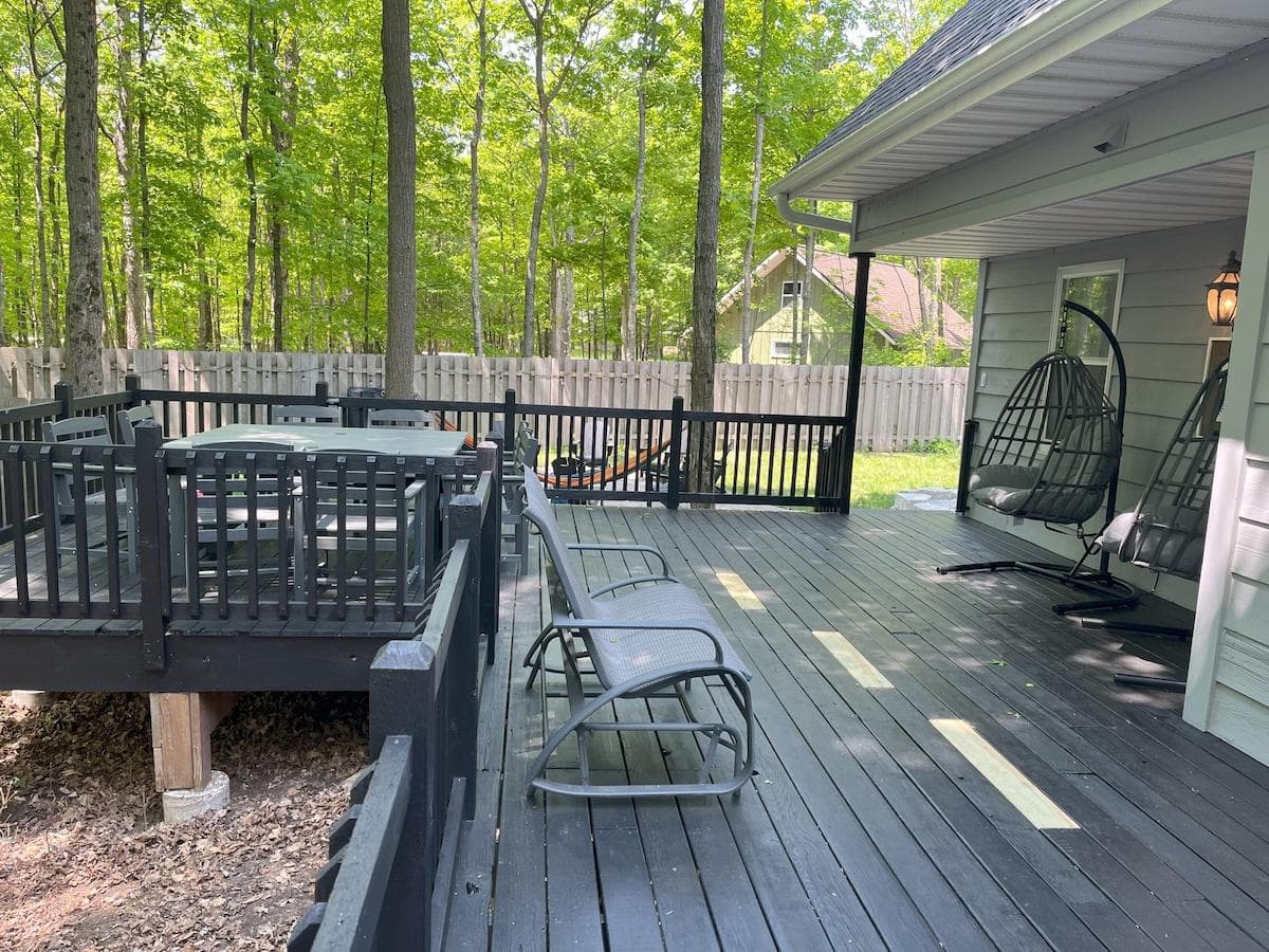 Step out onto the spacious deck, surrounded by trees and outfitted with seating areas perfect for lounging, sipping, or stargazing.
